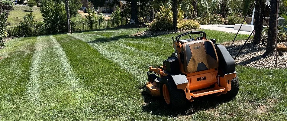 A lawn mower on a green lawn in Matthews, NC.