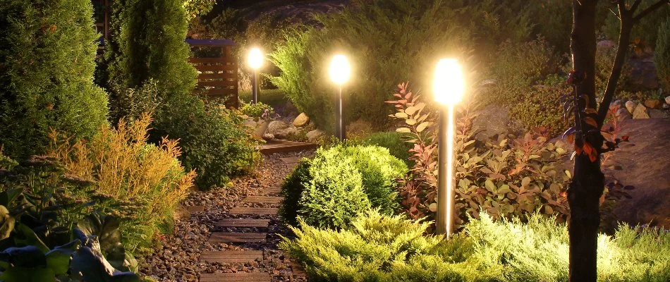 Outdoor lights on a landscape bed along a walkway in New Salem, NC.