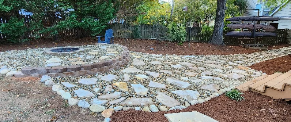 Patio and fire pit with a walkway in Albemarle, NC.