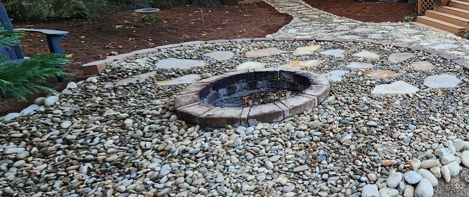 Round fire pit on a patio in Concord, NC.