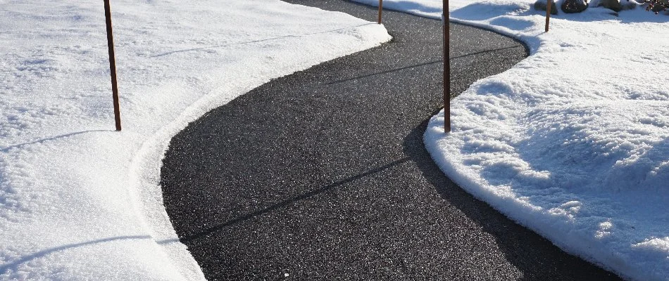 Snow along a cleared sidewalk in Matthews, NC.